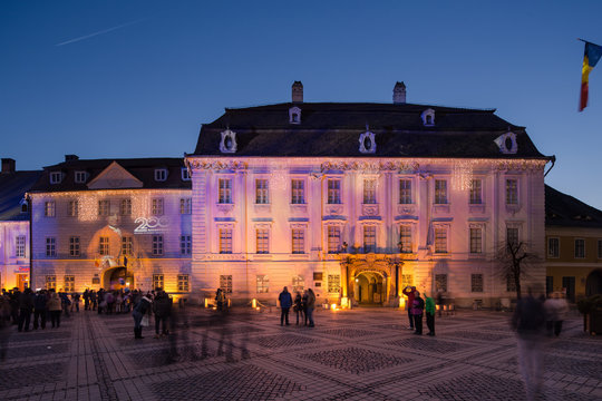 Brukenthal Museum in Sibiu, a famous baroque building from XVIIIth century in Transylvania Romania, by night in winter with Christmas decoration
