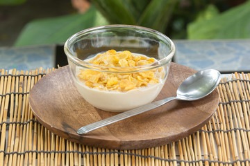 cornflakes with milk on the  cup