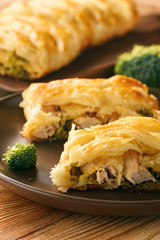 Homemade pie stuffed with broccoli, chicken and cheese.