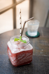 Watermelon smoothie on rustic wood table