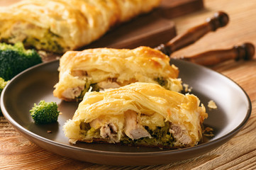 Homemade pie stuffed with broccoli, chicken and cheese.