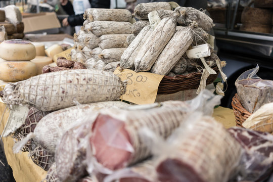 Sausages and cheese on display in Italian food market