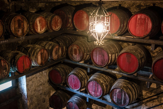 Vin santo dessert wine oak barrels aging in wine cellar