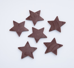 Obraz premium Chocolate or chocolate star on a background.