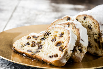 Christmas stollen. Traditional German Christmas dessert on wooden background
