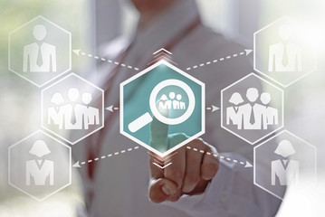 Business, finance, technology and internet concept - businesswoman presses a button magnifier with a group of employees on a virtual screen. Businessman searches for personnel. Find, staff, loupe.