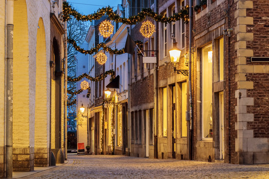 Shopping street with christmas lights in the city of Maastricht