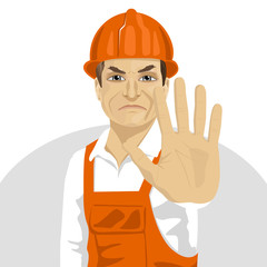 mature road worker in hard hat showing stop gesture