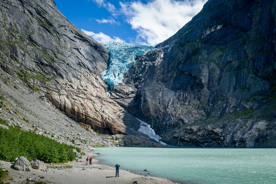 Tourists at Briksdalsbreen glacier viewpoint, Norway.