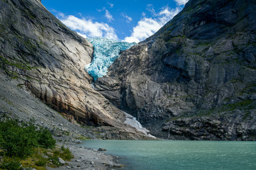 Fototapeta na wymiar Briksdalsbreen glacier and sun beam