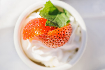 cake with whipped cream garnished with strawberries