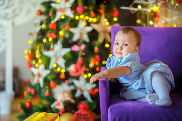 Fototapeta na wymiar beautiful little girl in a festive interior