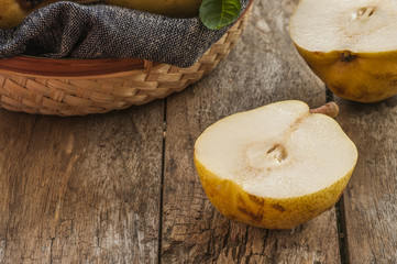 fresh ripe organic pears on a rustic wooden table