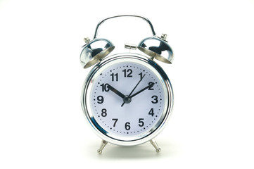 10:10 O' Clock silver alarm clock on white background, Timing co