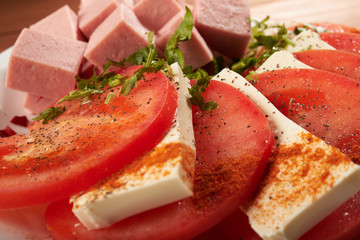 meat salad with tomato and cheese