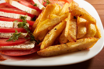 salad with tomato and cheese fries