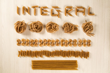 Variety of types and shapes of dry Italian integral pasta