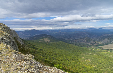 Fototapeta na wymiar View from the top of the ridge. Crimean mountains, September.