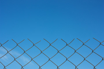 Sky behind the fence.