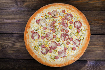 Delicious italian pizza served on wooden table