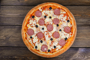 Delicious italian pizza served on wooden table