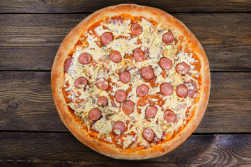 Delicious italian pizza served on wooden table