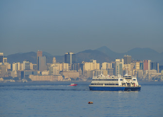 Brazil, City of Rio de Janeiro, Ferry going from Niteroi to the Barcas Maritime Station and the city viewed from the Guanabara Bay side.