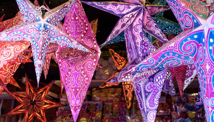 stars of colored paper to hang for christmas - 129350955