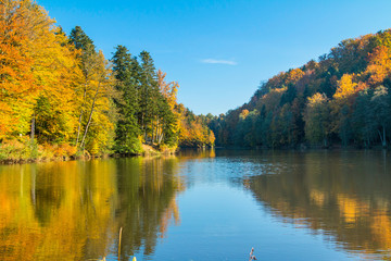 Reflection of trees on Trakoscan lake in Zagorje, Croatia, season, colorful autumn landscape