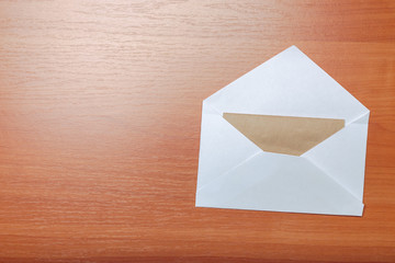 Photo of blank envelope on a  wooden background