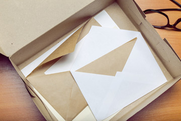 Photo of blank envelope on a  wooden background