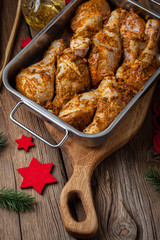 Marinated chicken drumsticks ready for baking.