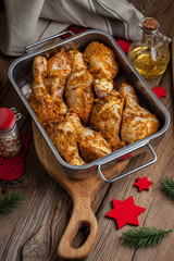 Marinated chicken drumsticks ready for baking.