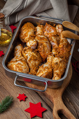 Marinated chicken drumsticks ready for baking.