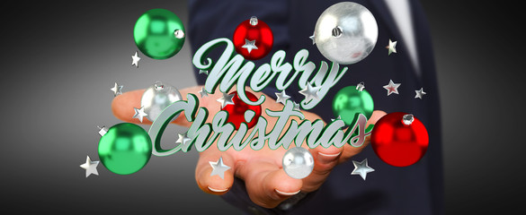 Businessman holding floating christmas message in his hand 3D re