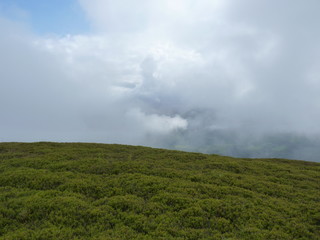 Foggy mountains. Beautiful landscape rainy clouds moody weather colors scenic background. Bieszczady mountains, Poland