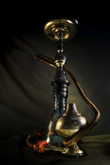 Obraz na płótnie Canvas Nargile-Hookah With Engraved Equipment and Tobacco in Dark Environment