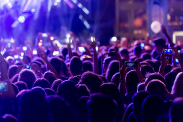 Hand with a smartphone records live music festiva © ververidis