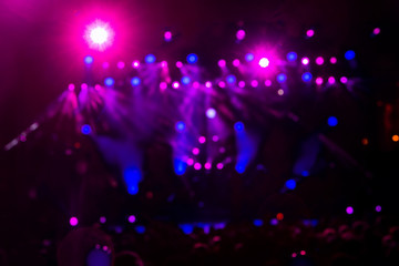 Fototapeta na wymiar Defocused entertainment concert lighting on stage, bokeh
