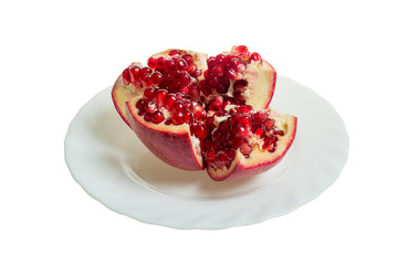 Pomegranate slices and garnet fruit seeds on table. Pomegranate whole. Useful fruit.