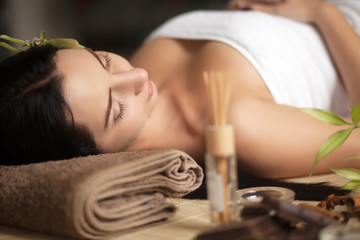 Obraz na płótnie Canvas Beautiful woman having relaxing in spa massage salon.