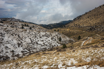 Winter mountain snowy landscape near ski center on mount Helmos,