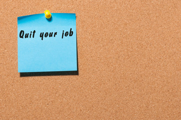 Quit your job - motivate inscription on blue sticker pinned at cork notice board. With empty space for text
