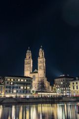 Fototapeta na wymiar View of the Grossmunster cathedral in Zurich from the riverside