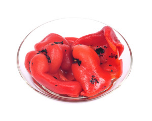 Fire roasted red peppers in bowl separated on white background