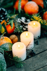 Christmas composition with Tangerines, Pine cones, Walnuts and C