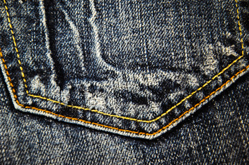 Pocket of a blue jeans.  Fabric background