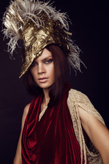 Woman in head wear with feathers