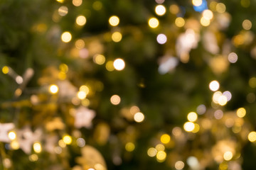 christmas tree bokeh light in green yellow golden color, holiday abstract background, blur defocused - Powered by Adobe