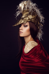 Woman in head wear with feathers